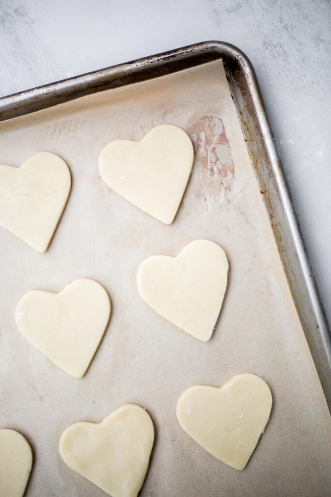 sourdough sugar cookies cut out on a tray