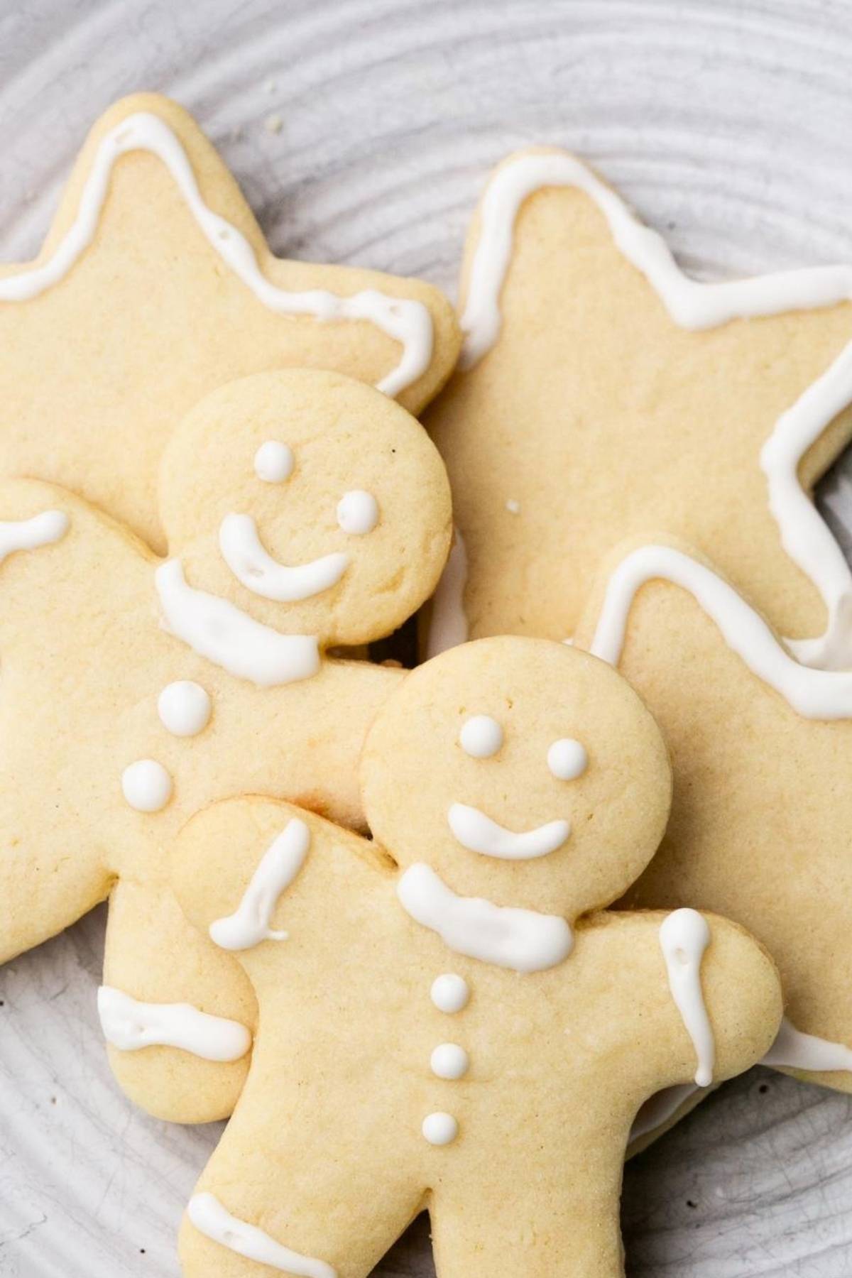 A gray plate with star shaped sourdough discard sugar cookies on it.