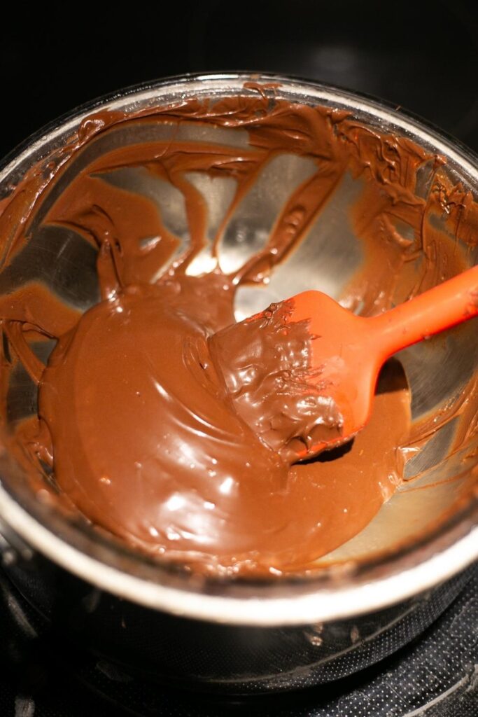 gourmet chocolate chips being stirred in a double boiler
