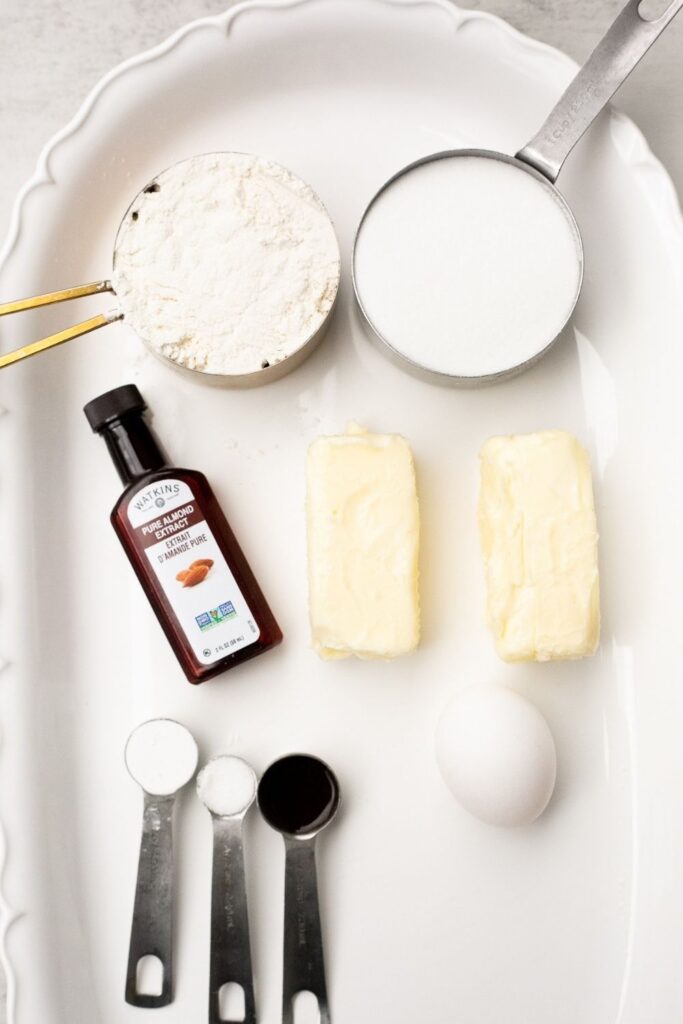 ingredients for valentines day sugar cookies on a tray