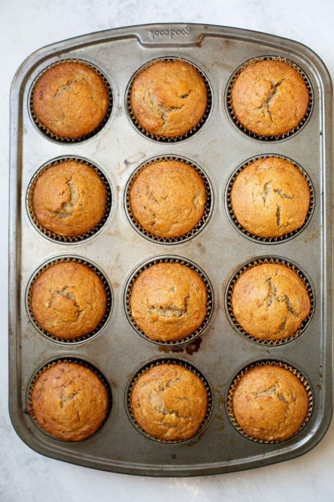 sourdough discard banana muffins in a muffin tin.