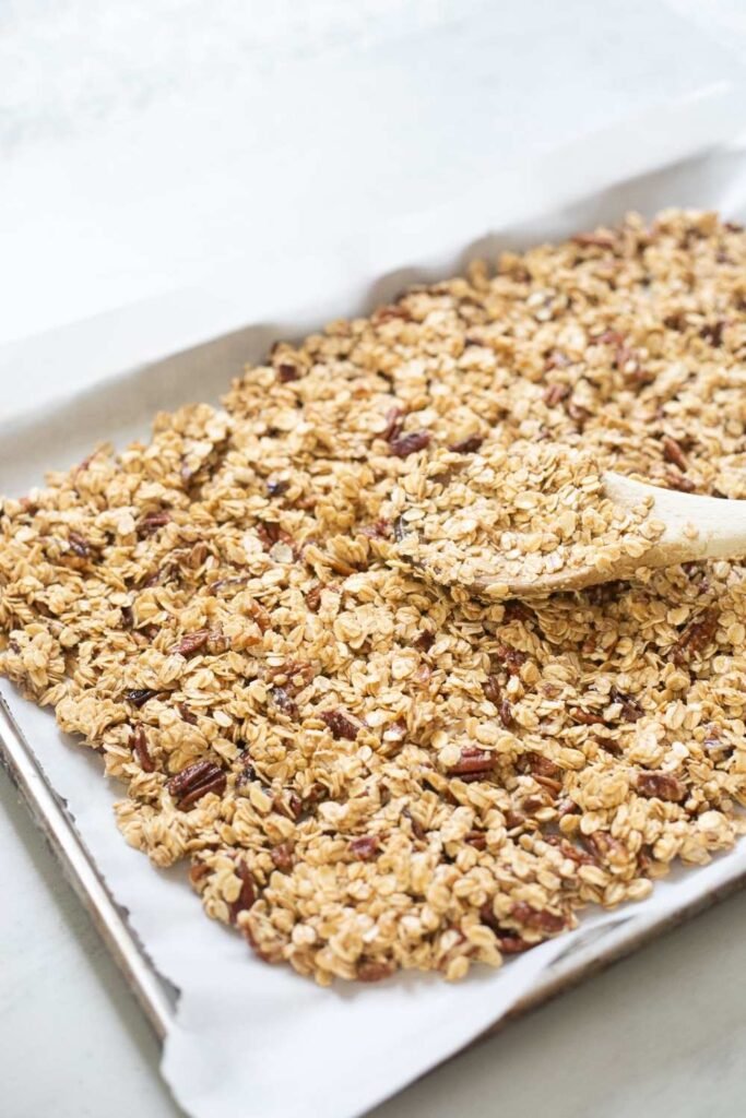 sourdough discard granola on a baking sheet before putting in oven