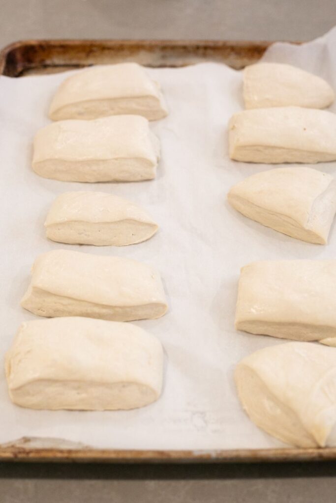 sourdough ciabatta dough cut into sandwich sized pieces and put on a baking sheet