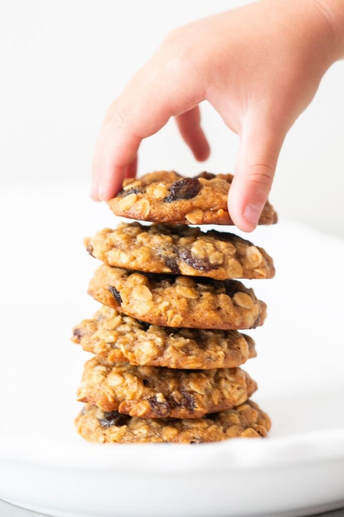 a stack of sourdough discard oatmeal raisin cookies