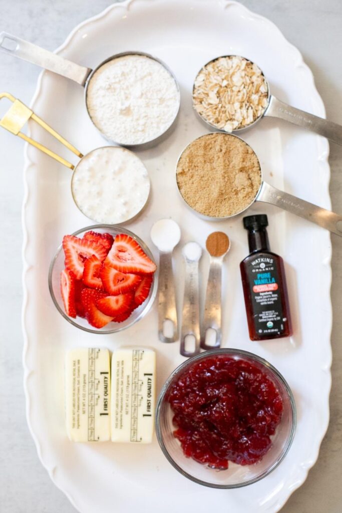 ingredients for sourdough discard strawberry jam crumble bars on a tray
