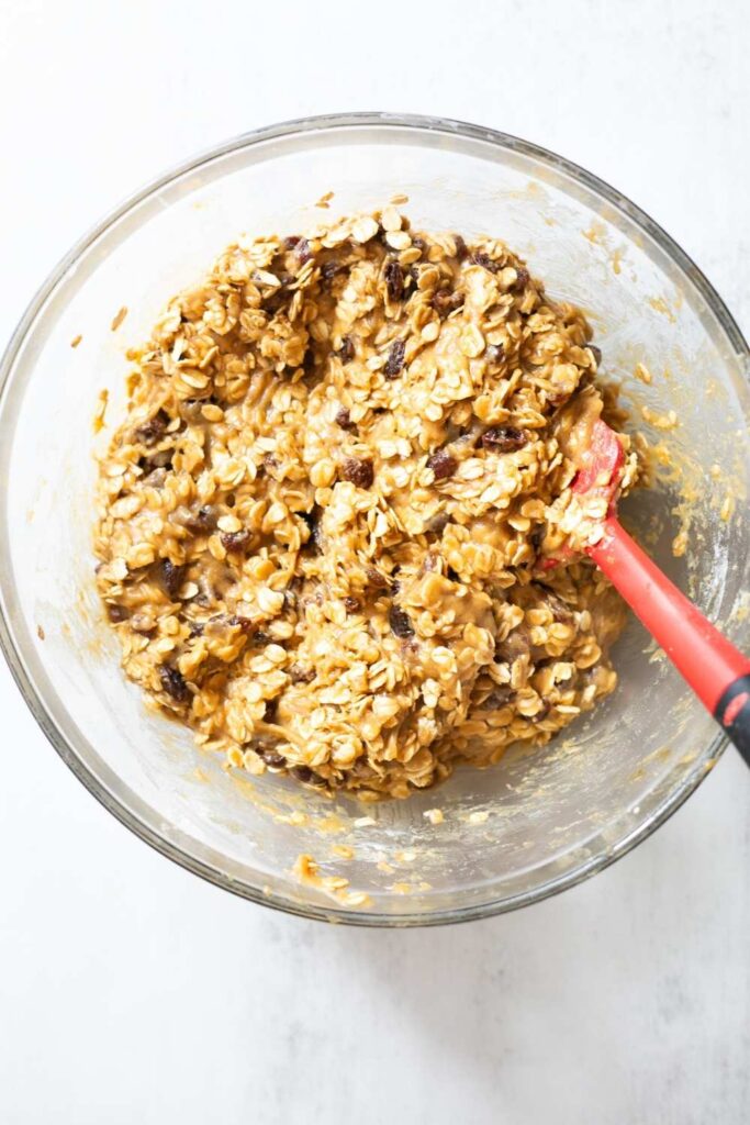 oatmeal and raisins in a bowl with sourdough discard oatmeal raisin cookies