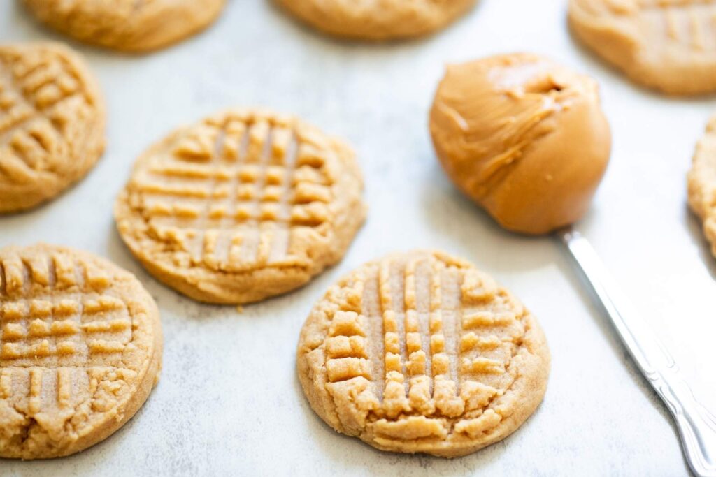 chewy and soft sourdough discard peanut butter cookies on a tray
