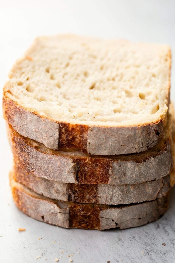 slices of sourdough bread baked in a loaf pan