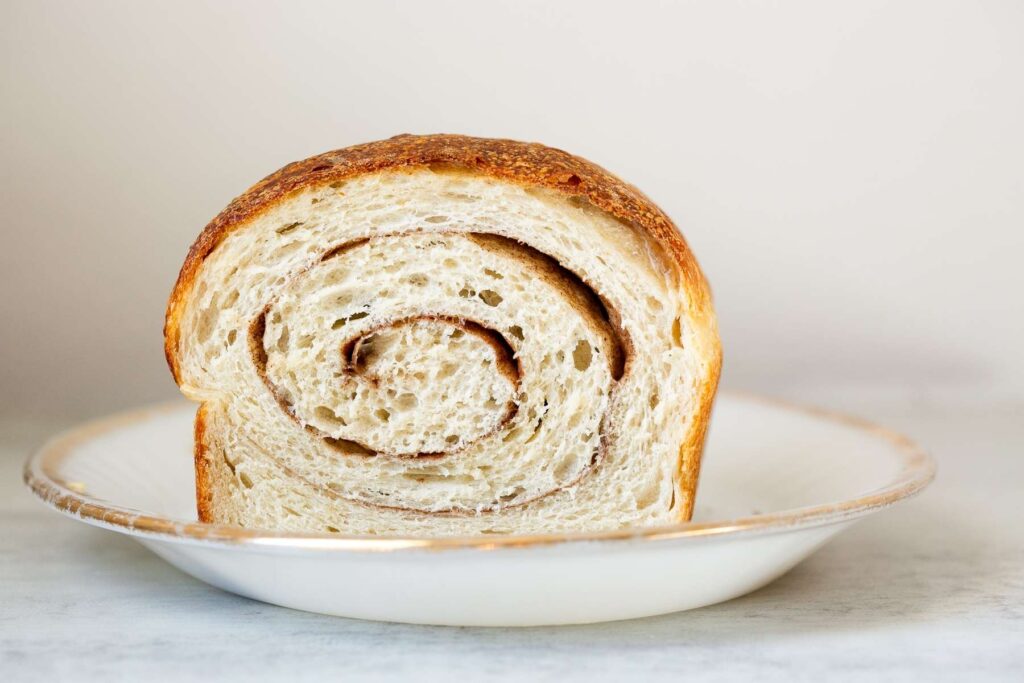 sourdough cinnamon swirl sandwich bread loaf on a table