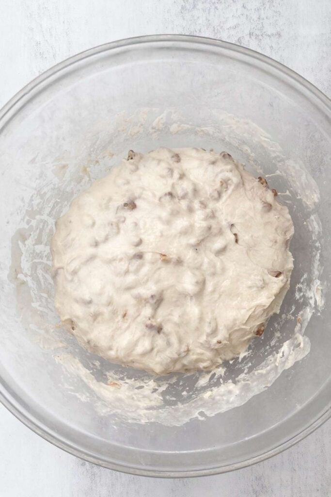 Sourdough maple pecan bread loaf dough in a large bowl.