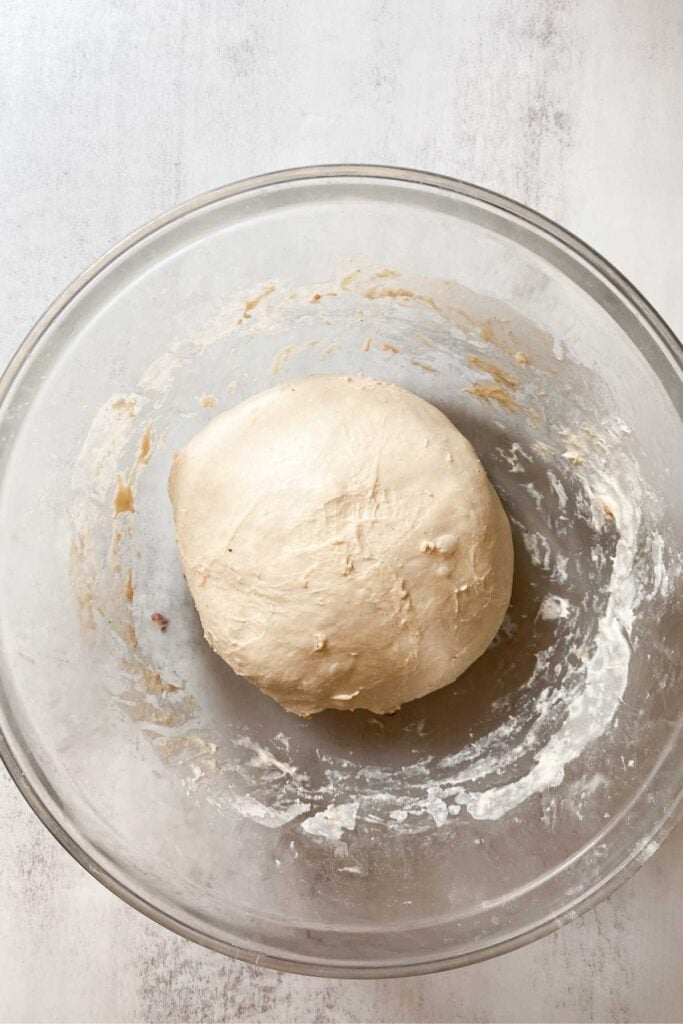 Sourdough maple pecan bread dough in a bowl.