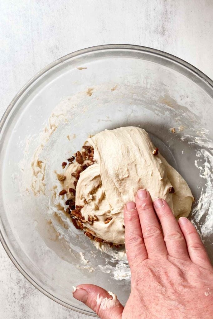 Sourdough maple pecan bread with stretch and folds in a bowl.