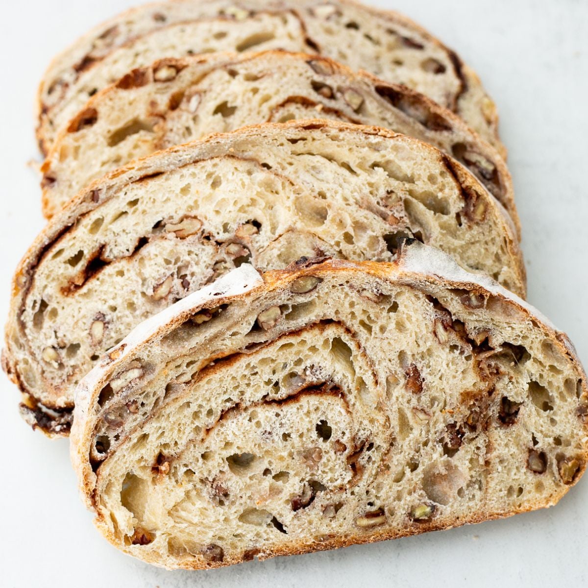 sourdough maple pecan cinnamon swirl bread loaf.