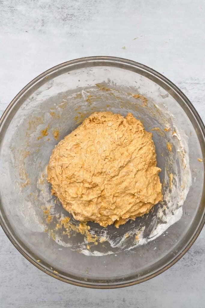 Dough for artisan sourdough pumpkin bread in a large bread bowl.